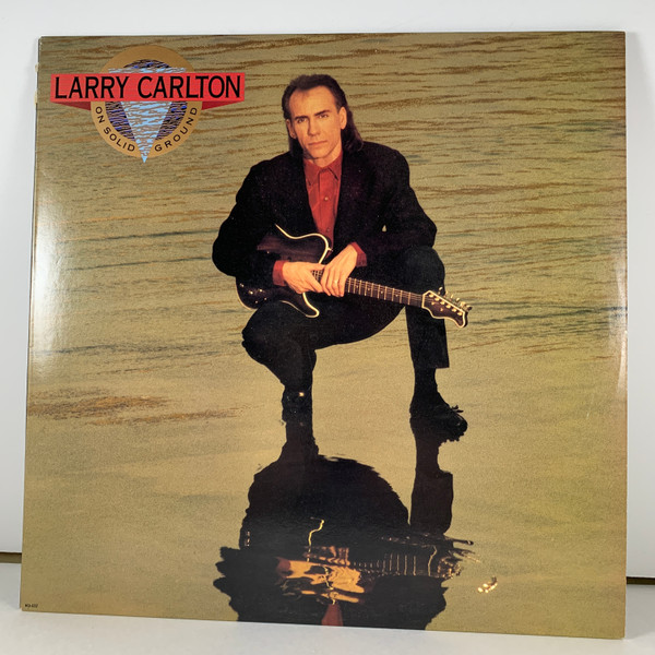 Larry Carlton - On Solid Ground | MCA Records (MCA 6237)