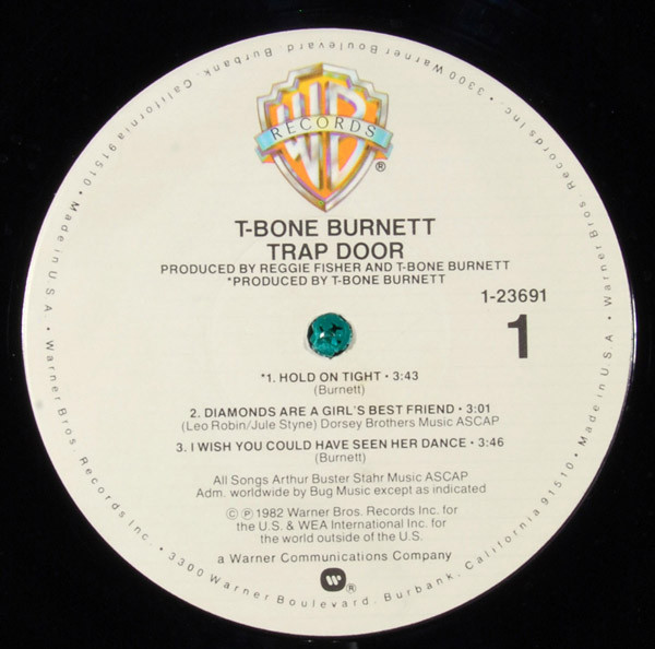 T-Bone Burnett - Trap Door | Warner Bros. Records (9 23691-1 b) - 3