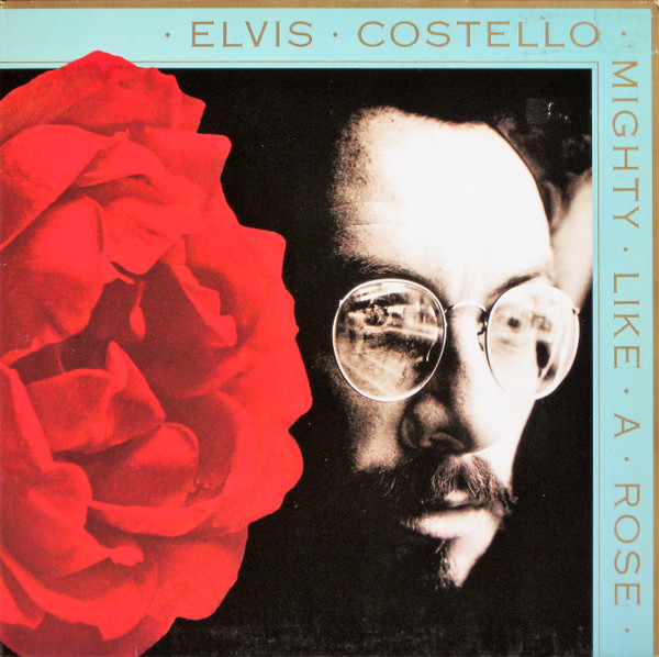 Elvis Costello - Mighty Like A Rose | Warner Bros. Records (7599-26575-1)