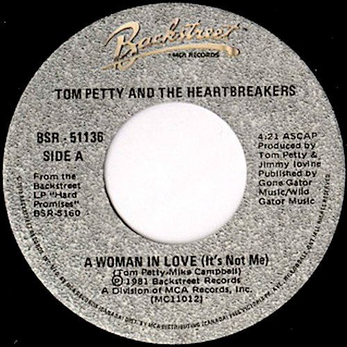 Tom Petty And The Heartbreakers - A Woman In Love (It's Not Me) / Gator On The Lawn (7") [Vinyl] | Backstreet Records (BSR-51136) - main